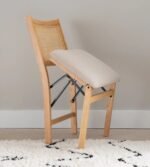 Elegant Natural Wood and Rattan Folding Chair with Upholstered Beige Seat - Image 4
